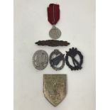 Six reproduction WWII Third Reich badges.