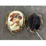 A large cameo style brooch with painted porcelain plaque and a silver and blue john brooch.