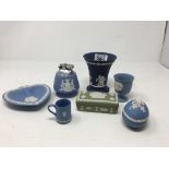 An assortment of Wedgwood jasperware ceramics in various colours.