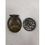 Two reproduction Nazi badges.