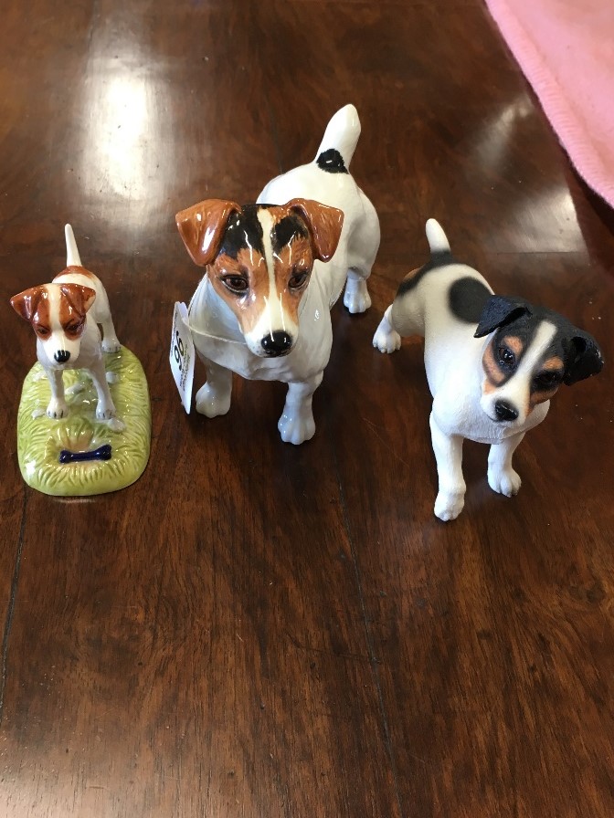 Three assorted figures of Jack Russell dogs.