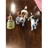 Three assorted figures of Jack Russell dogs.