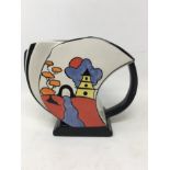 A Lorna Bailey Art Deco style water jug and Lorna Bailey signed jar and cover.
