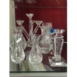 An assortment of crystal vases, candelabra, etc