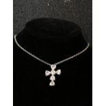 A silver and CZ crucifix and chain.