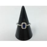 A 18ct white gold, sapphire and diamond ring.