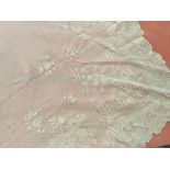 A collection of antique white lace pieces.