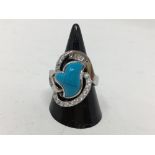 A silver, CZ and turquoise dress ring of unusual design.