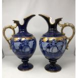 A large pair of Continental ceramic ewers.