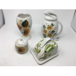 Four pieces of hand painted Radford ceramics.