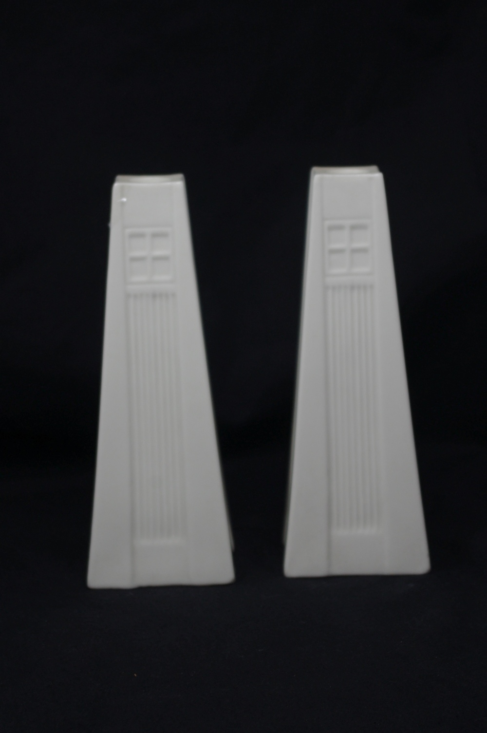 A pair of Belleek tower candlesticks.