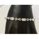 A silver and CZ tennis style bracelet.