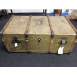 A canvas and wooden bound travelling trunk with lift out tray.