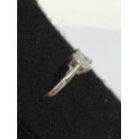 An 18ct white gold solitaire princess cut diamond ring of approximately 75 points.