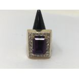 A gold, amethyst and diamond ring of large proportions.