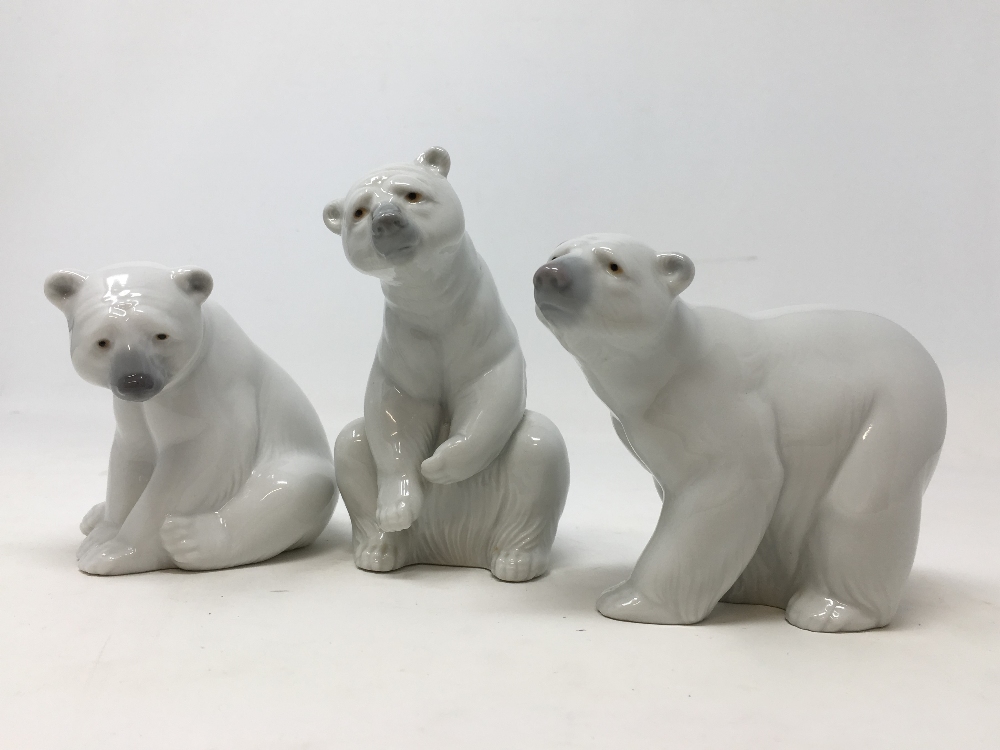 Three Lladro polar bears.