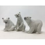 Three Lladro polar bears.