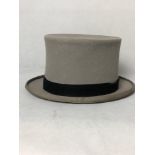 A grey top hat with black band.