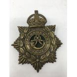 An original early 20th century brass helmet plate badge to the Oxfordshire Regiment.