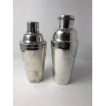 Two silver plated cocktail shakers.