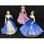 Three Royal Doulton figurines.