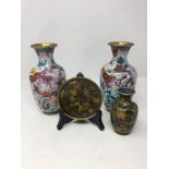 A pair of Chinese cloisonné vases and a miniature cloisonné vase and saucer.