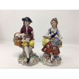 A pair of Sitzendorf porcelain figures.