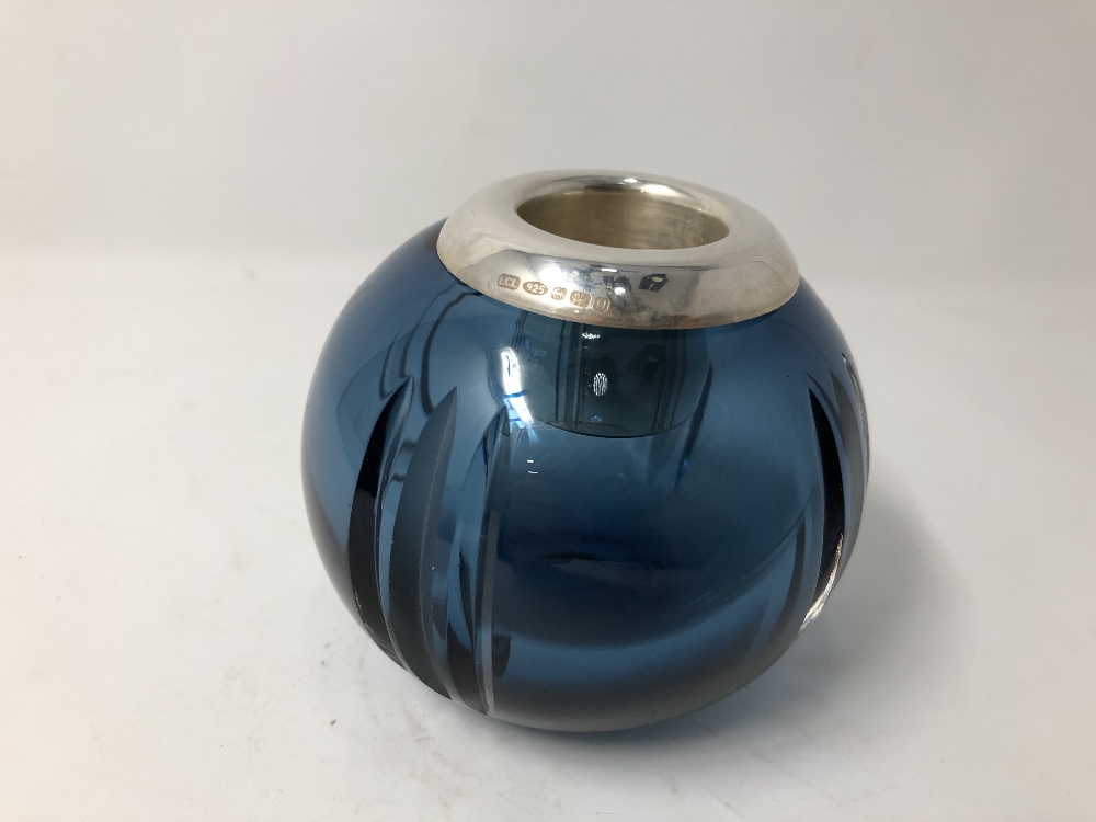 A contemporary blue glass bulbous shaped silver topped match striker.