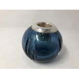 A contemporary blue glass bulbous shaped silver topped match striker.