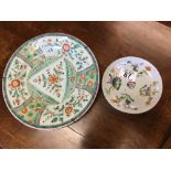 An early 19th Century Chinese wall plate and a 19th Century Chinese saucer bowl.