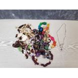 A box of assorted costume jewellery including a Dyrberg Kern necklace.