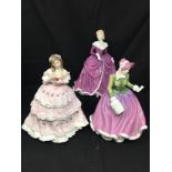 Three Royal Doulton figurines.