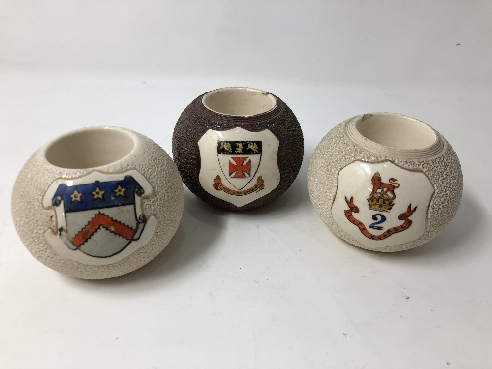 Three stoneware MacIntyre match holders all with coats of arms.