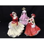 Three Royal Doulton figurines.