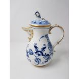 A Meissen union pattern blue and white coffee pot with flower bud finial.