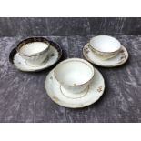 Two 18th Century tea bowls and saucers and a 19th Century tea bowl and saucer.