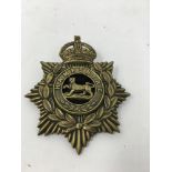 An original early 20th century brass helmet plate badge to the Hampshire Regiment.