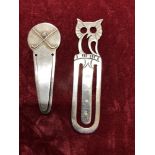 A silver book mark with an owl finial and a similar golfing book mark.