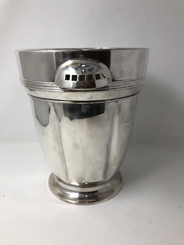 A silver plated twin handled ice bucket.