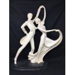 A signed A. Antini Art Deco figure of a couple dancing.