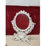 A Victorian cast metal oval shaped vanity mirror.