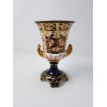A Royal Crown Derby imari patterned twin handled pedestal urn.