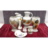 Eight pieces of Radford hand painted pottery.