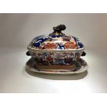 A 19th Century Imari pattern Mason's sauce tureen and cover with drip plate.