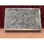 A Middle Eastern silver cigarette box.