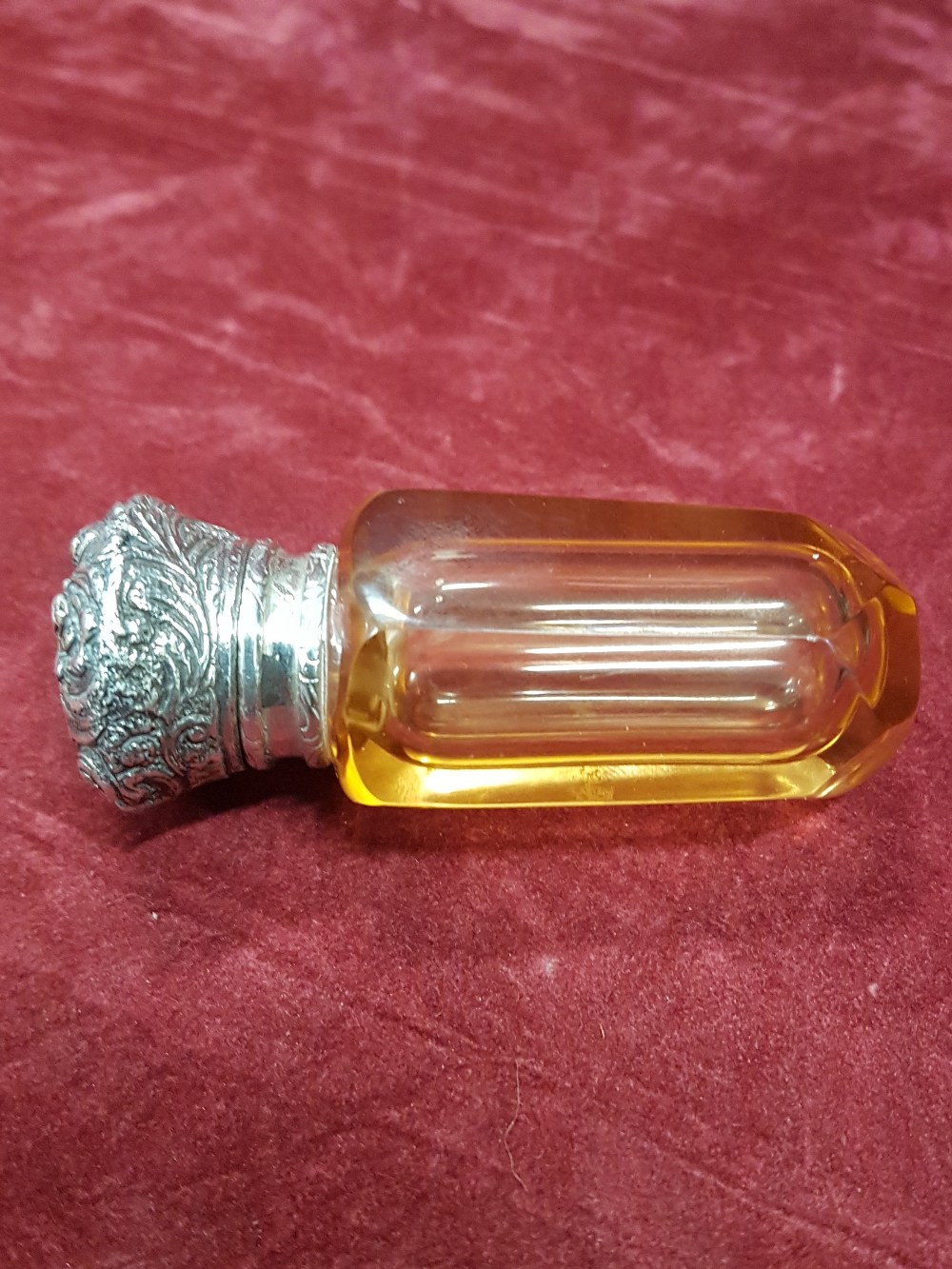 A silver topped and glass vinaigrette.