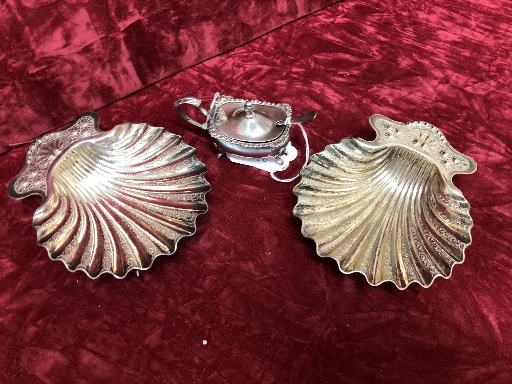 Two scallop shaped dishes and a silver mustard pot.