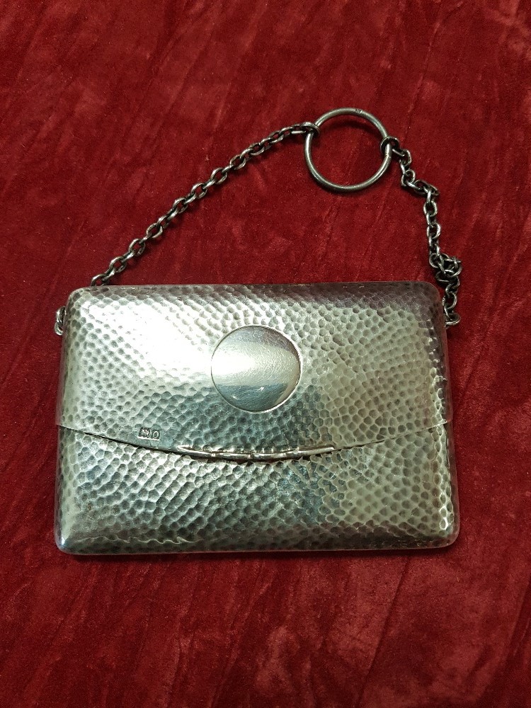 A silver lady's finger purse.