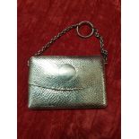 A silver lady's finger purse.