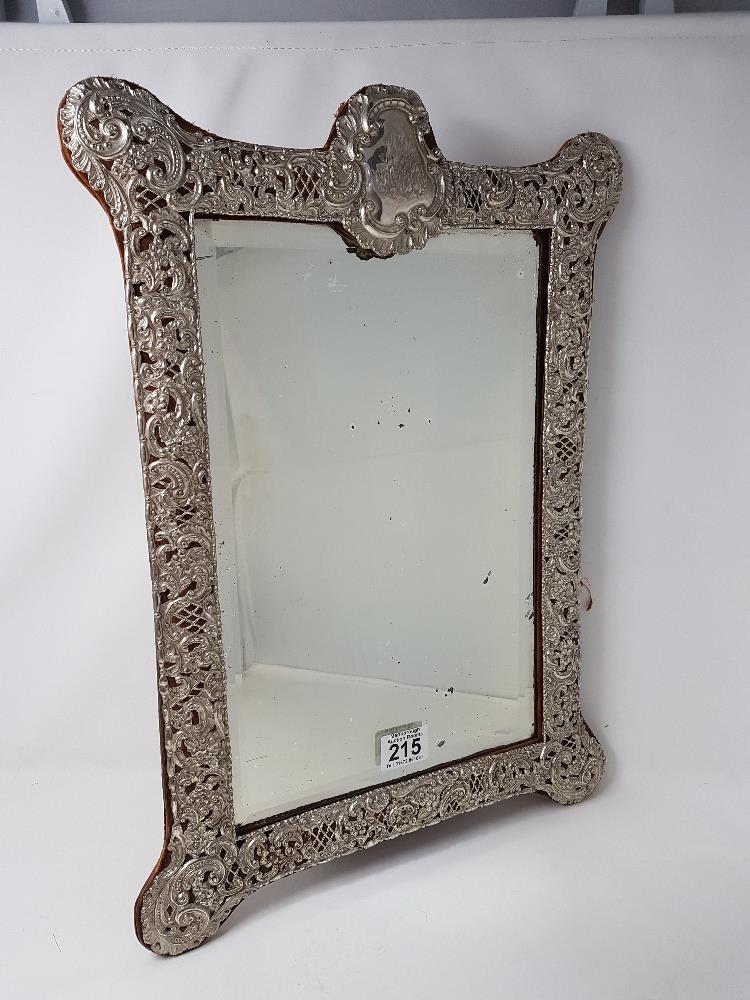 A large decorative 19th Century silver easel mirror with fine filigree decoration, on velvet.